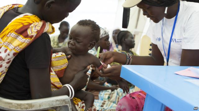 VOA File Photo: In this photo of Friday, July 25, 2014, a child with suspected malnutrition is examined at IMC nutrition program clinic in Malakal, South Sudan.